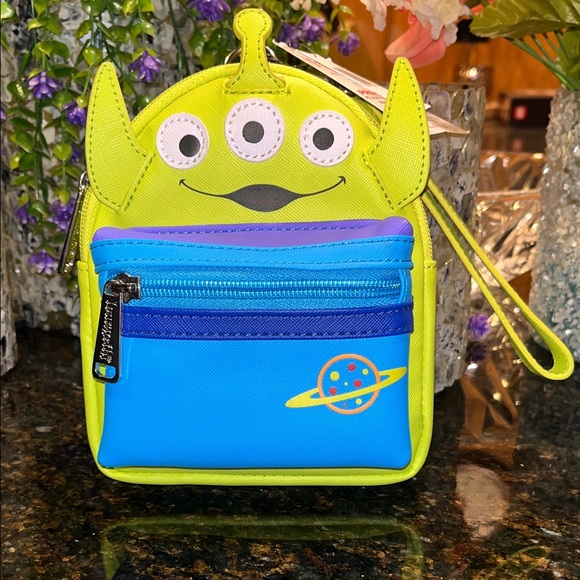 Loungefly Handbags - Disney parks loungefly Toy Story Alien Wristlet